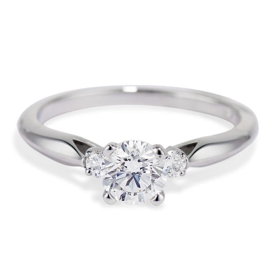3 diamond ring Round center diamond and mini side round diamonds Platinum 4 prong with airline